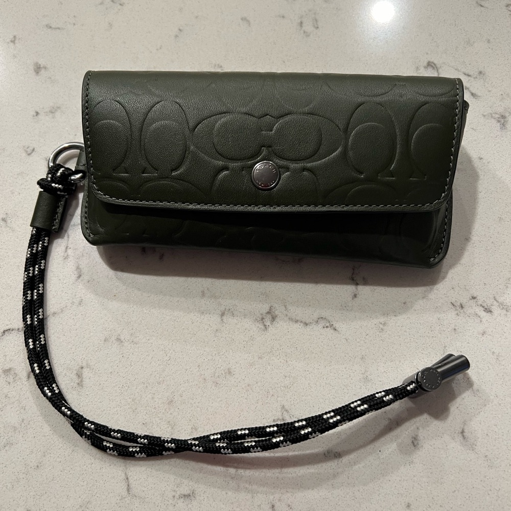 Coach green sun glasses case that can go on belt.